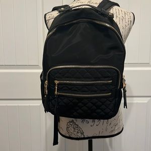 Black Backpack w/gold zippers,Quilted zipped pockets, pockets inside and out
